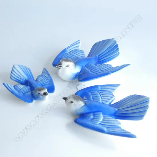 A set of three Poole wall mounting blue birds,